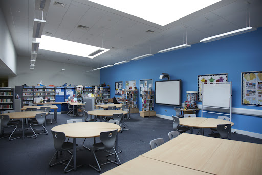 Photo of the Library area inside Longfield Academy, showing the tables and chairs in the foreground.