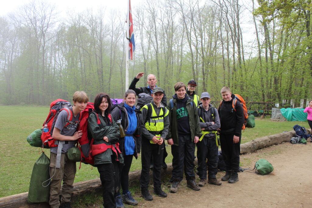 A group of students are seen smiling for the camera alongside a member of staff on a Duke of Edinburgh practice event in 2023.