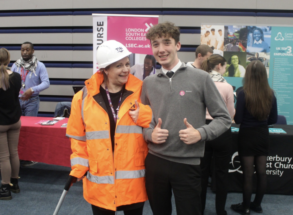 A photo taken of a staff member and student at the Longfield Academy Careers Fair 2024.